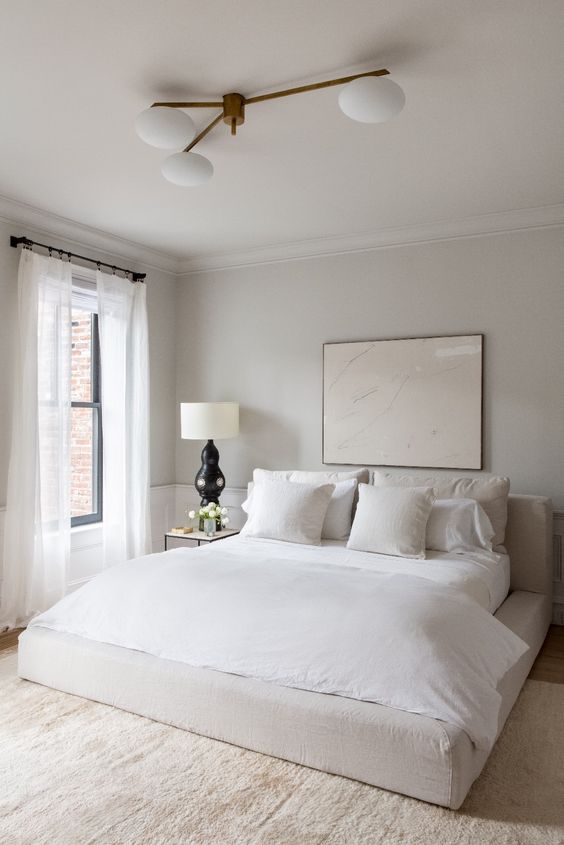 White bed in white room